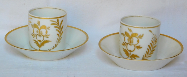 Pair of Empire Paris porcelain coffee cups enhanced with fine gold, early 19th century