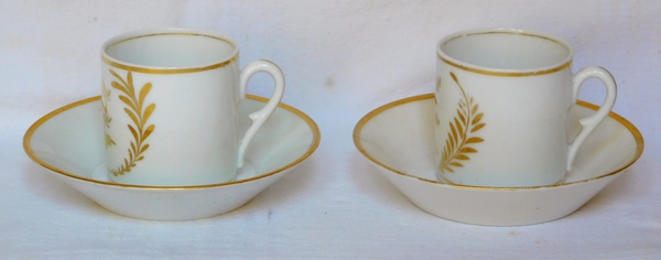 Pair of Empire Paris porcelain coffee cups enhanced with fine gold, early 19th century