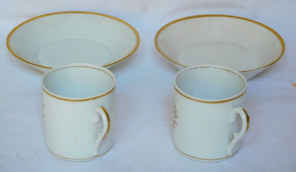 Pair of Empire Paris porcelain coffee cups enhanced with fine gold, early 19th century