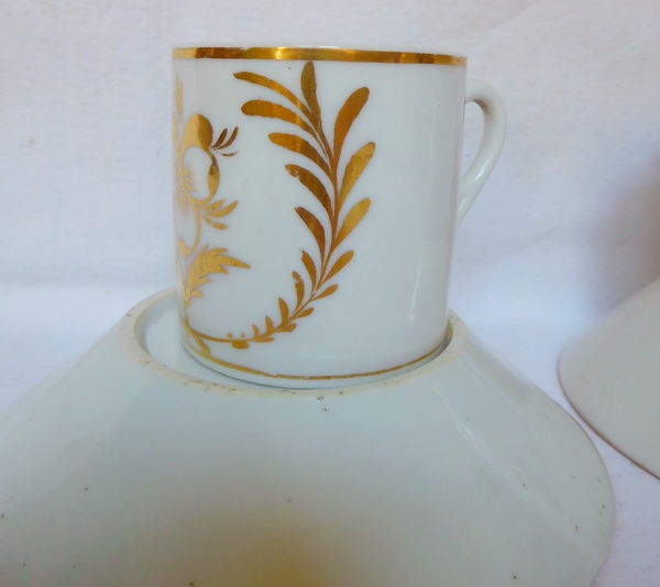 Pair of Empire Paris porcelain coffee cups enhanced with fine gold, early 19th century