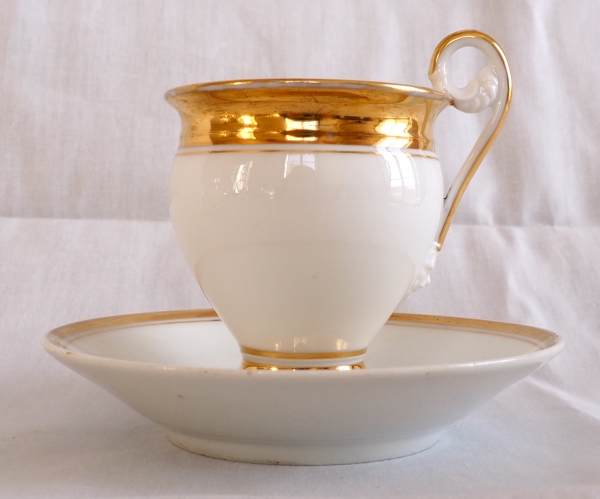 Pair of Empire Paris porcelain coffee cups enhanced with fine gold, early 19th century