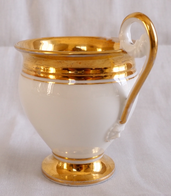 Pair of Empire Paris porcelain coffee cups enhanced with fine gold, early 19th century