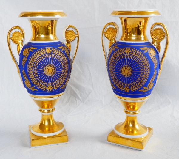 Pair of Empire Paris porcelain and biscuit vases, polychromatic and gilt decoration