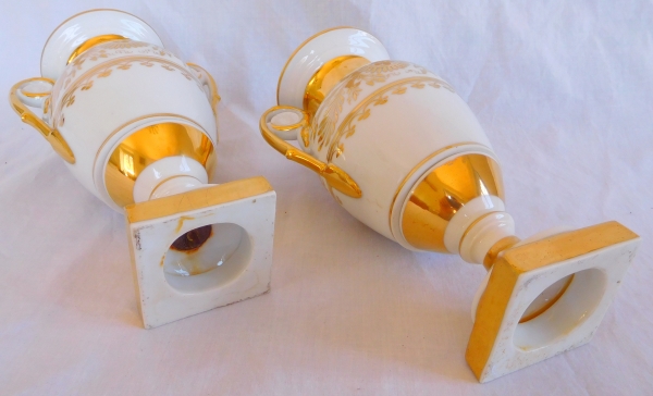 Pair of Empire Paris porcelain vases enhanced with fine gold, early 19th century