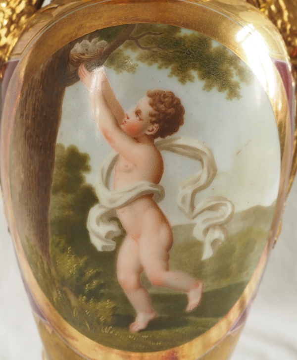 Pair of Empire Paris porcelain vases, polychromatic and gilt decoration - putto stealing eggs