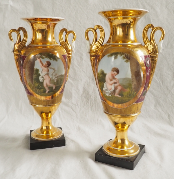 Pair of Empire Paris porcelain vases, polychromatic and gilt decoration - putto stealing eggs