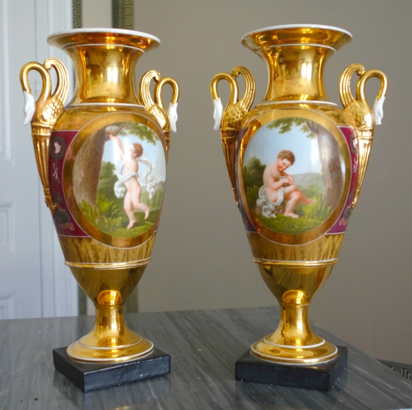 Pair of Empire Paris porcelain vases, polychromatic and gilt decoration - putto stealing eggs
