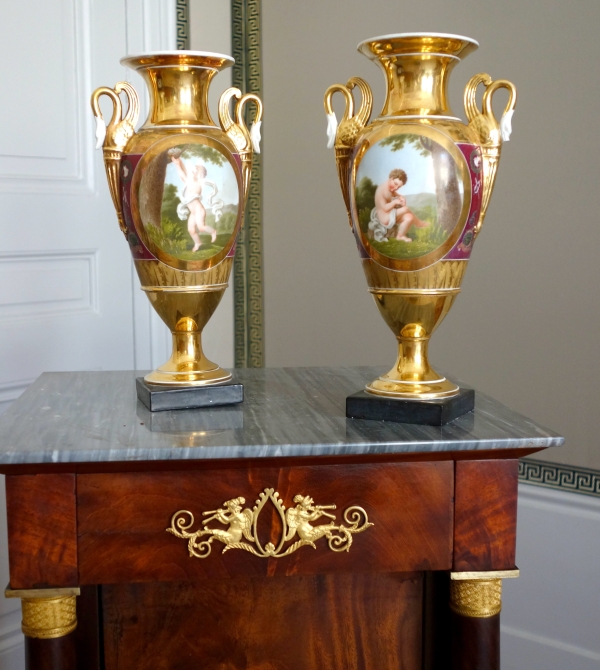 Pair of Empire Paris porcelain vases, polychromatic and gilt decoration - putto stealing eggs