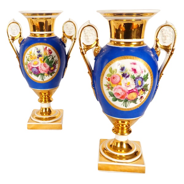 Pair of Paris porcelain Empire vases - flowers on a gilt and blue background - early 19th century