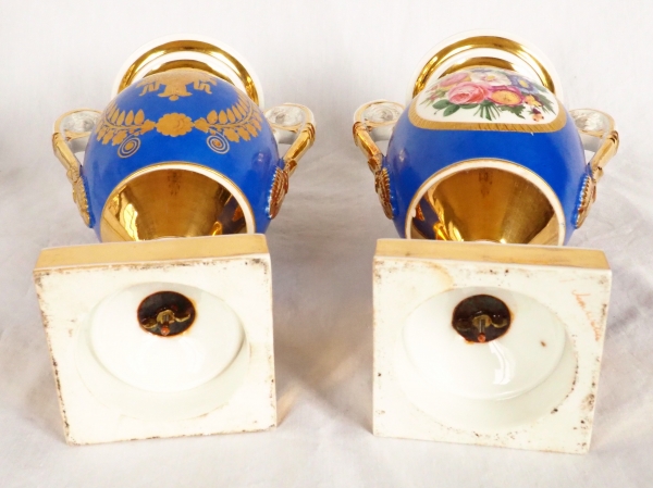 Pair of Paris porcelain Empire vases - flowers on a gilt and blue background - early 19th century