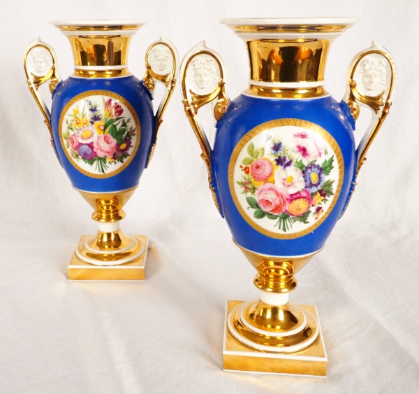 Pair of Paris porcelain Empire vases - flowers on a gilt and blue background - early 19th century