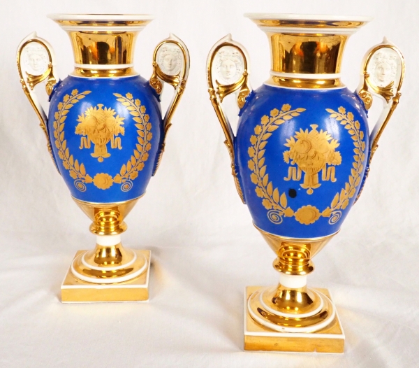 Pair of Paris porcelain Empire vases - flowers on a gilt and blue background - early 19th century