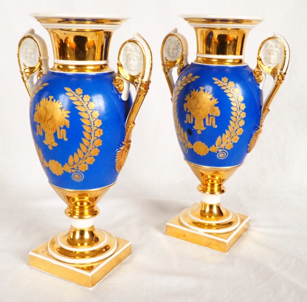 Pair of Paris porcelain Empire vases - flowers on a gilt and blue background - early 19th century