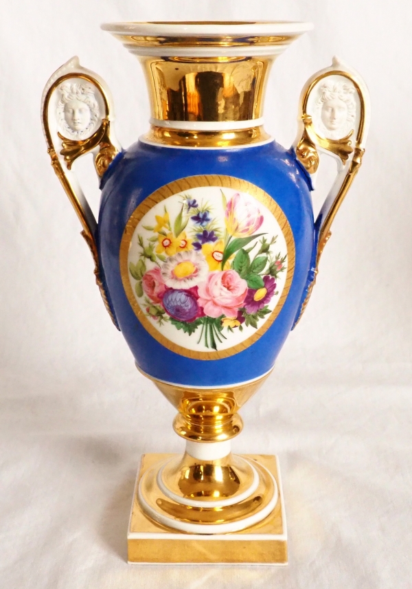 Pair of Paris porcelain Empire vases - flowers on a gilt and blue background - early 19th century