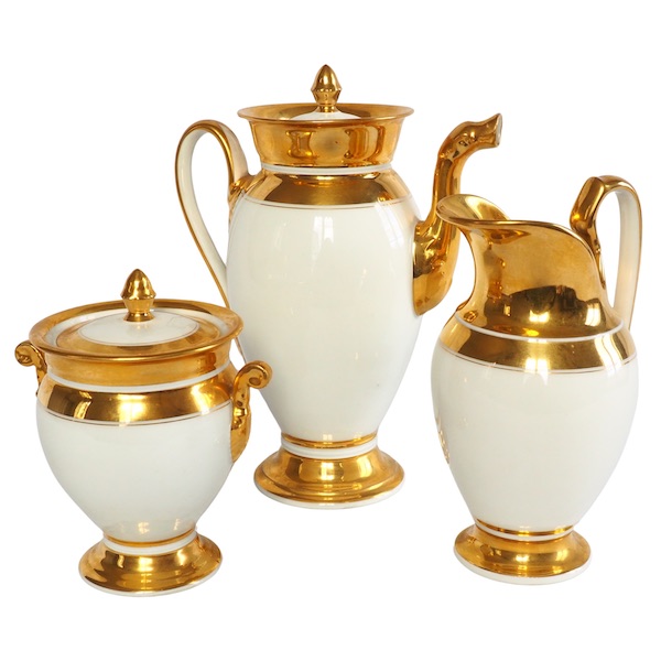 Paris porcelain coffee set enhanced with fine gold : coffee pot, sugar pot, milk jug