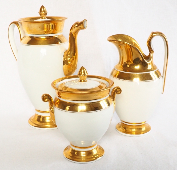 Paris porcelain coffee set enhanced with fine gold : coffee pot, sugar pot, milk jug