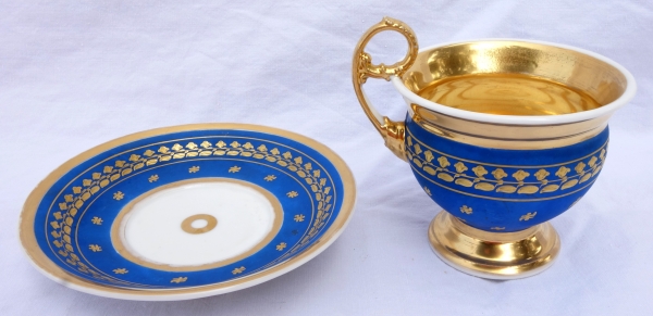 Large cup and its saucer, Paris porcelain - blue coloured biscuit enhanced with fine gold, 19th century