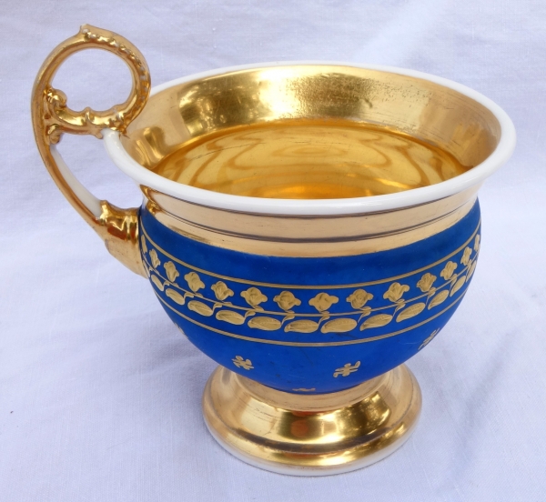 Large cup and its saucer, Paris porcelain - blue coloured biscuit enhanced with fine gold, 19th century