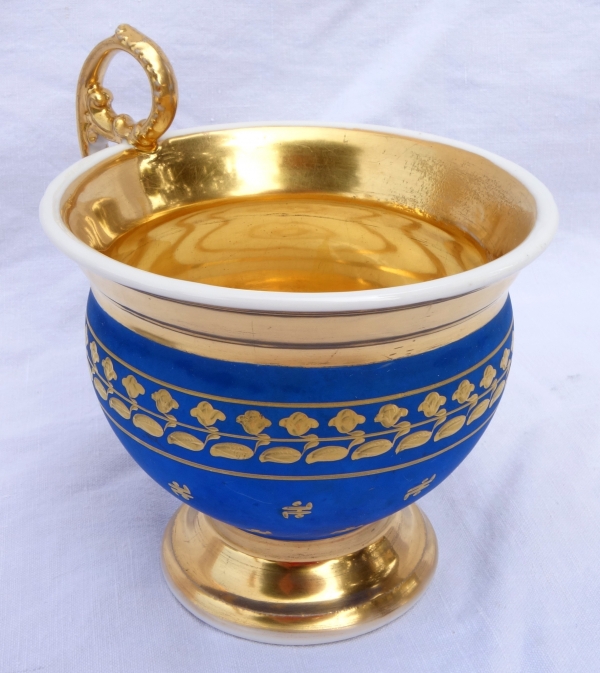 Large cup and its saucer, Paris porcelain - blue coloured biscuit enhanced with fine gold, 19th century