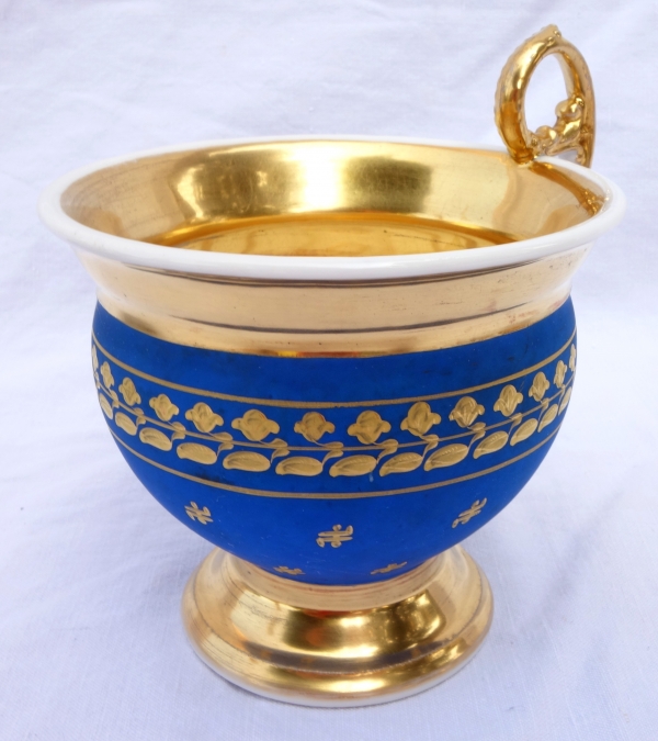 Large cup and its saucer, Paris porcelain - blue coloured biscuit enhanced with fine gold, 19th century