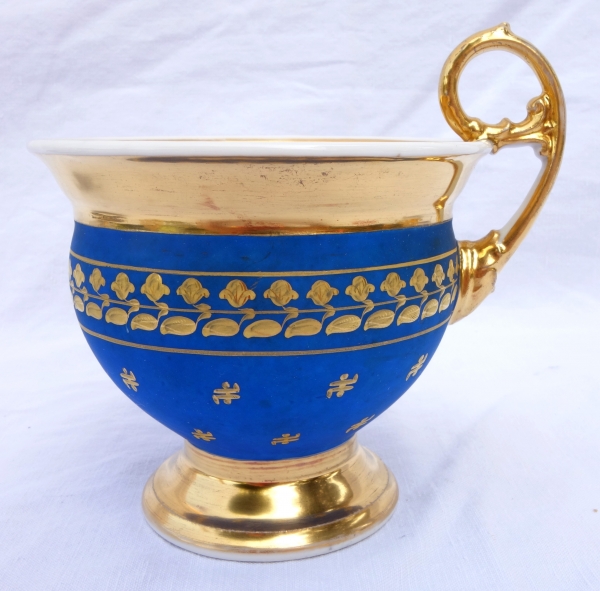 Large cup and its saucer, Paris porcelain - blue coloured biscuit enhanced with fine gold, 19th century