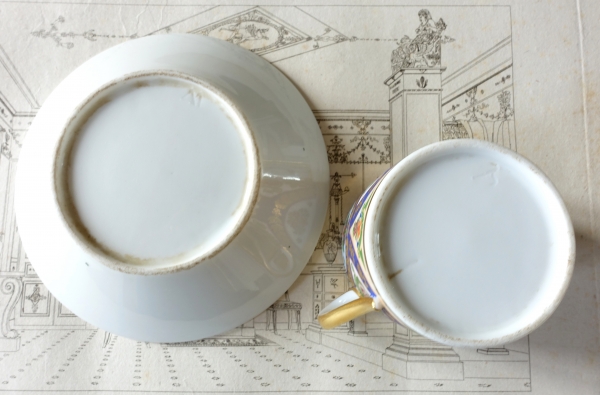 Porcelain and polychromatic biscuit coffee cup enhanced with fine gold, early 19th century