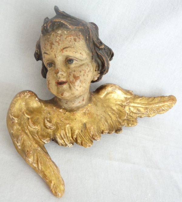 Pair of baroque winged angels busts, polychromatic and gilt wood, early 18th century