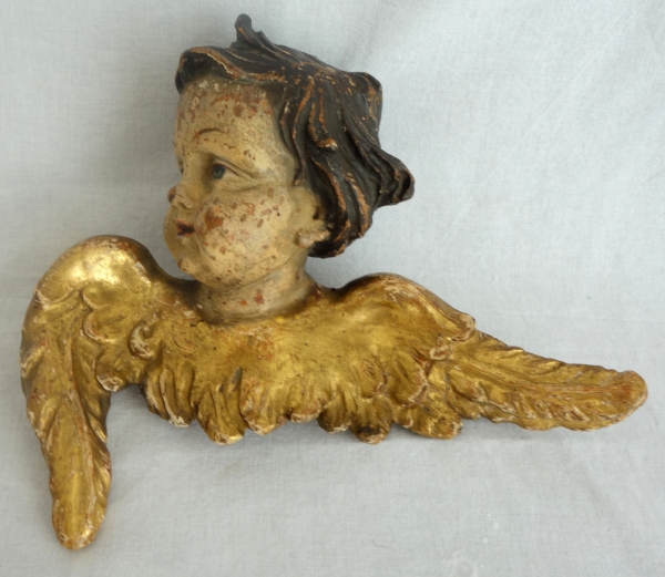Pair of baroque winged angels busts, polychromatic and gilt wood, early 18th century