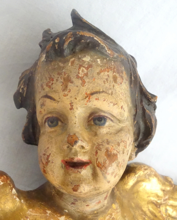 Pair of baroque winged angels busts, polychromatic and gilt wood, early 18th century