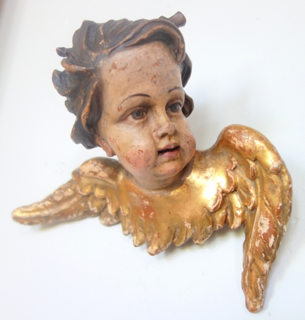 Pair of baroque winged angels busts, polychromatic and gilt wood, early 18th century