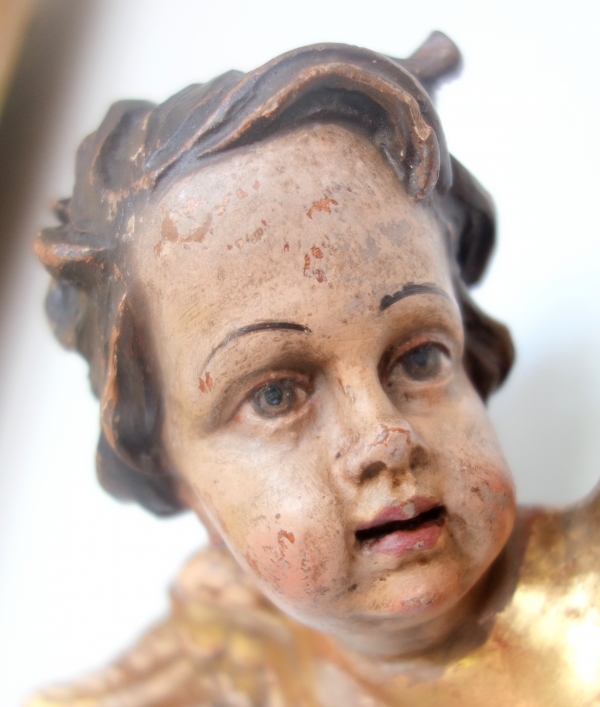 Pair of baroque winged angels busts, polychromatic and gilt wood, early 18th century
