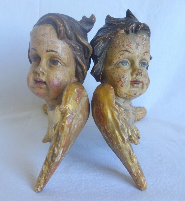 Pair of baroque winged angels busts, polychromatic and gilt wood, early 18th century