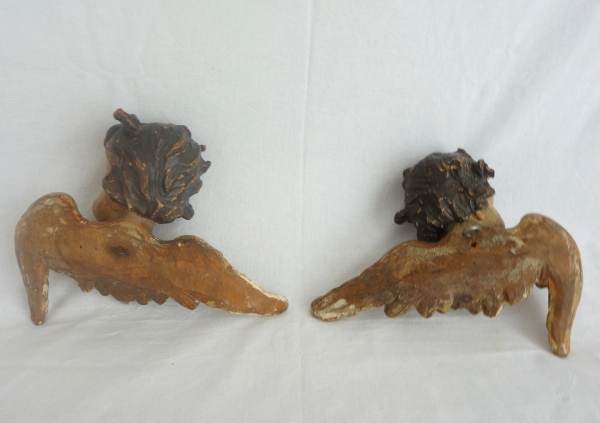 Pair of baroque winged angels busts, polychromatic and gilt wood, early 18th century