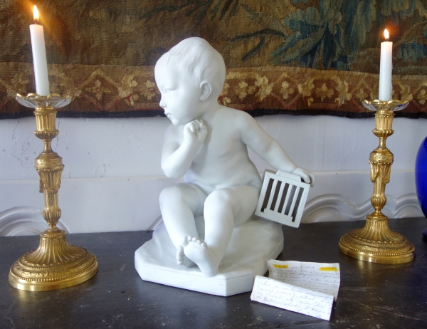 Tall porcelain biscuit : child with a cage after Jean Baptiste Pigalle - 36cm