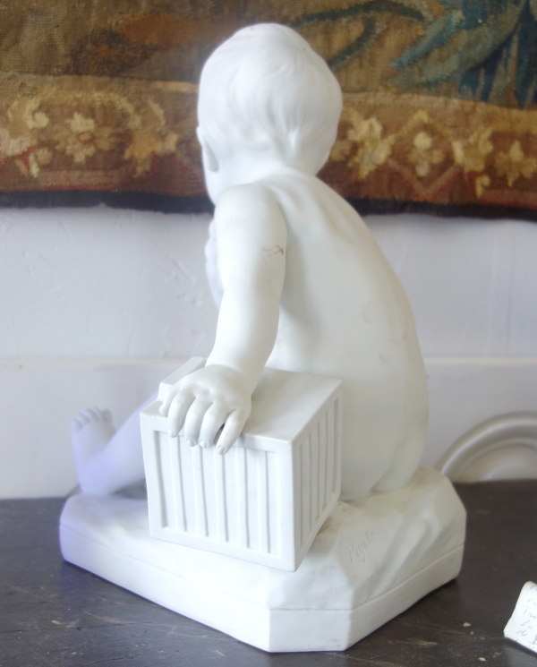 Tall porcelain biscuit : child with a cage after Jean Baptiste Pigalle - 36cm