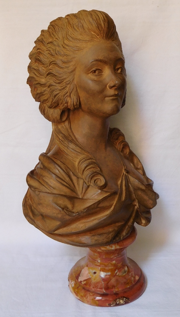 Terracotta bust of an aristocrat on a marble base, 18th century style, 19th century production