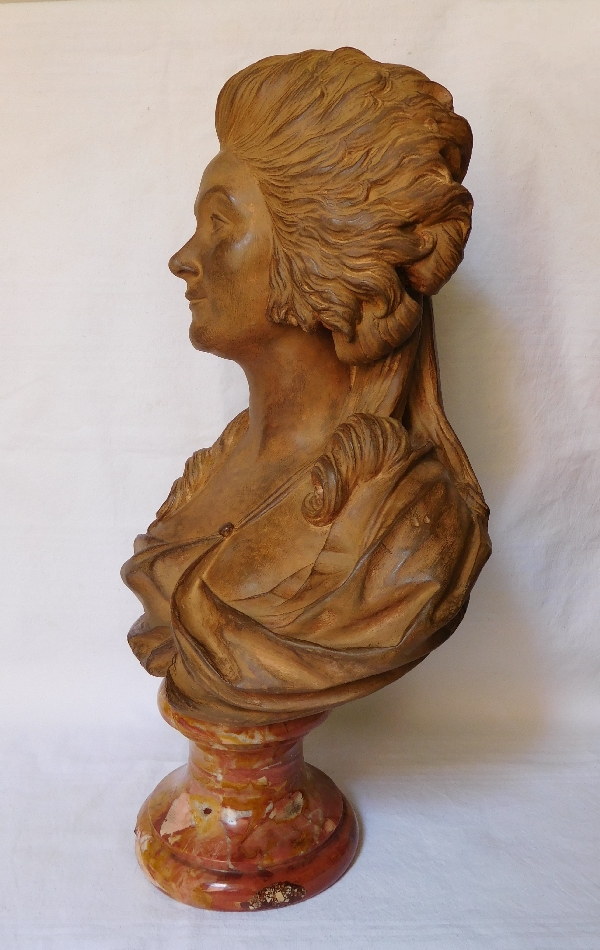 Terracotta bust of an aristocrat on a marble base, 18th century style, 19th century production