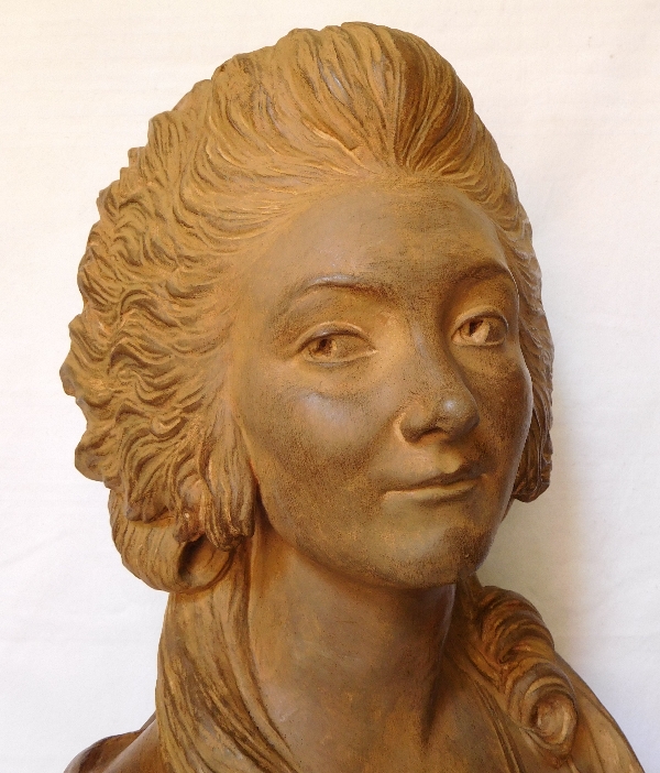 Terracotta bust of an aristocrat on a marble base, 18th century style, 19th century production