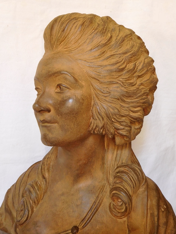 Terracotta bust of an aristocrat on a marble base, 18th century style, 19th century production