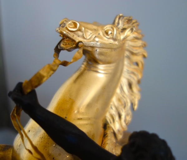 Cheval de Marly groupe en bronze patiné et doré au mercure d'après Coustou début XIXe siècle