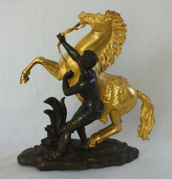 Cheval de Marly groupe en bronze patiné et doré au mercure d'après Coustou début XIXe siècle