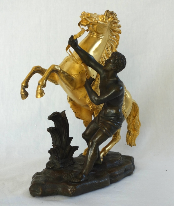 Cheval de Marly groupe en bronze patiné et doré au mercure d'après Coustou début XIXe siècle