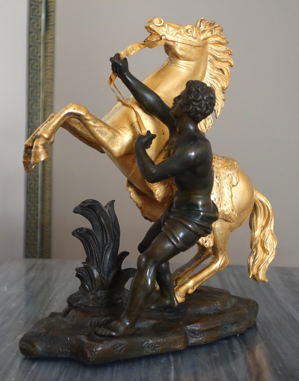 Cheval de Marly groupe en bronze patiné et doré au mercure d'après Coustou début XIXe siècle