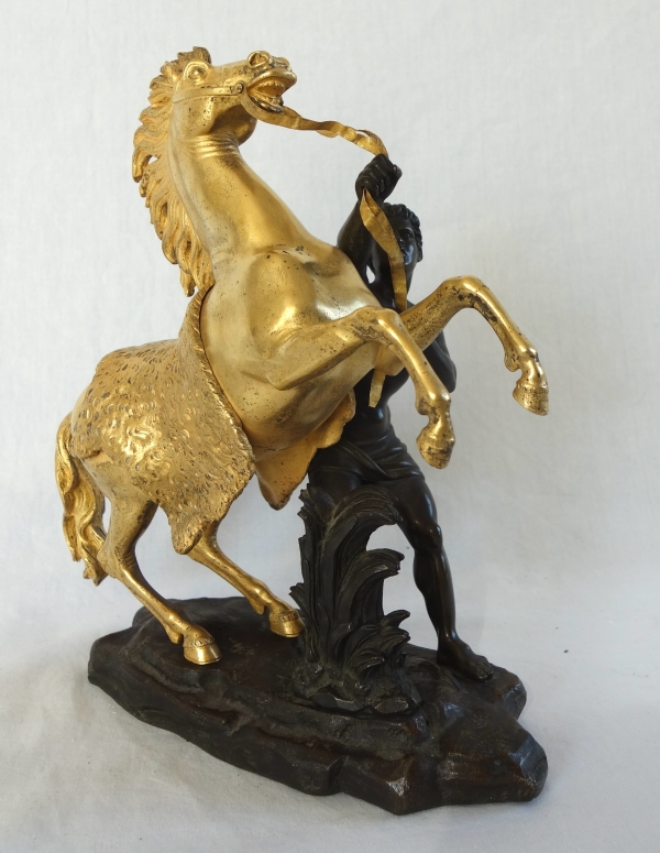 Cheval de Marly groupe en bronze patiné et doré au mercure d'après Coustou début XIXe siècle