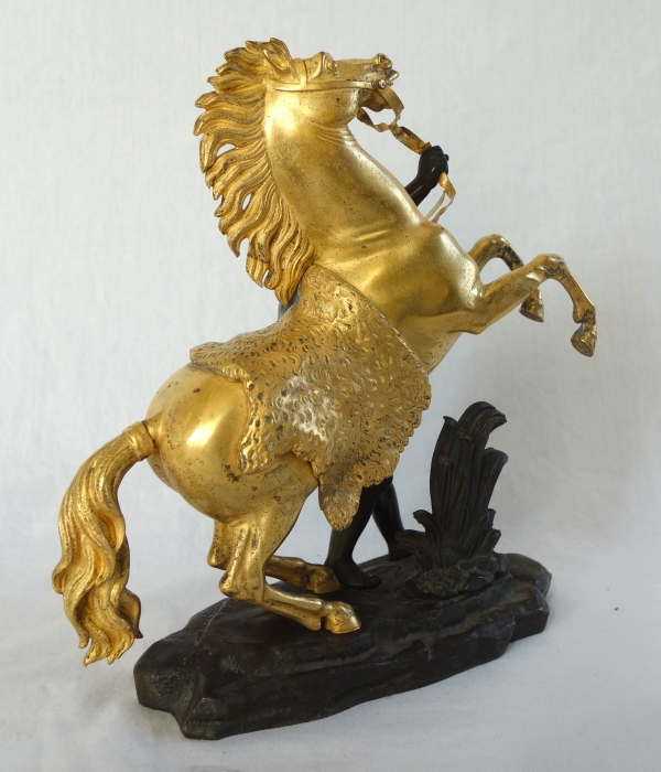 Cheval de Marly groupe en bronze patiné et doré au mercure d'après Coustou début XIXe siècle