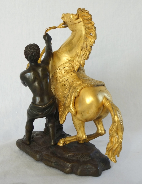 Cheval de Marly groupe en bronze patiné et doré au mercure d'après Coustou début XIXe siècle