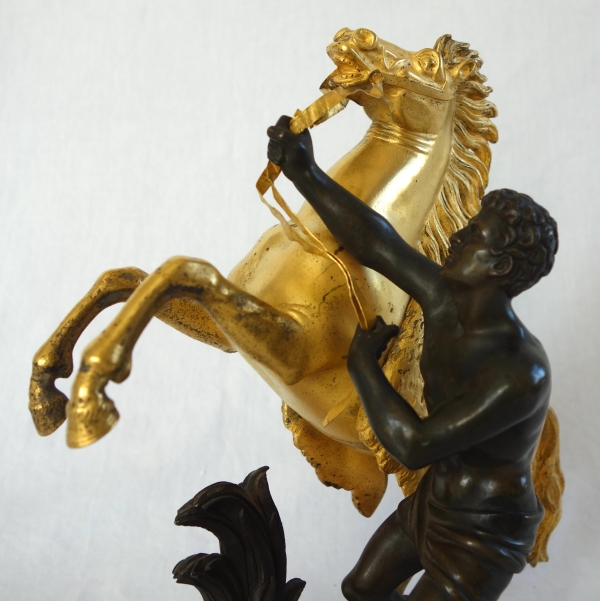 Cheval de Marly groupe en bronze patiné et doré au mercure d'après Coustou début XIXe siècle