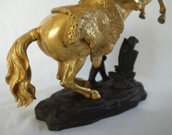 Cheval de Marly groupe en bronze patiné et doré au mercure d'après Coustou début XIXe siècle