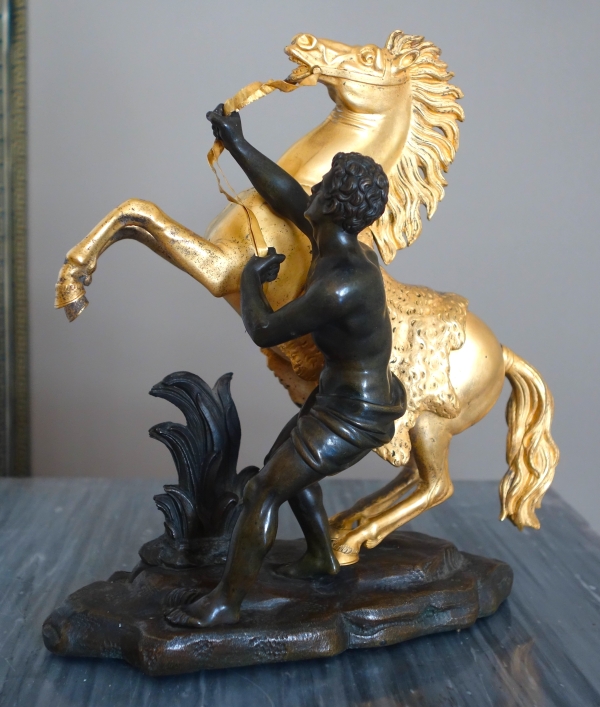 Cheval de Marly groupe en bronze patiné et doré au mercure d'après Coustou début XIXe siècle