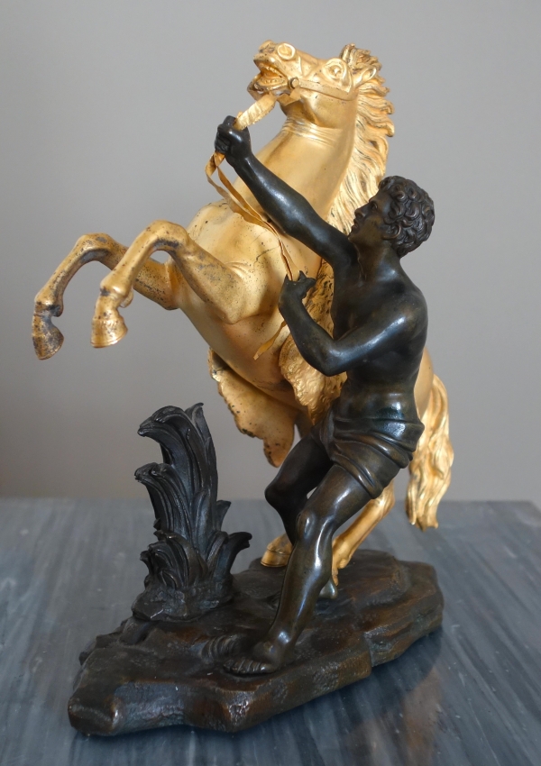 Cheval de Marly groupe en bronze patiné et doré au mercure d'après Coustou début XIXe siècle
